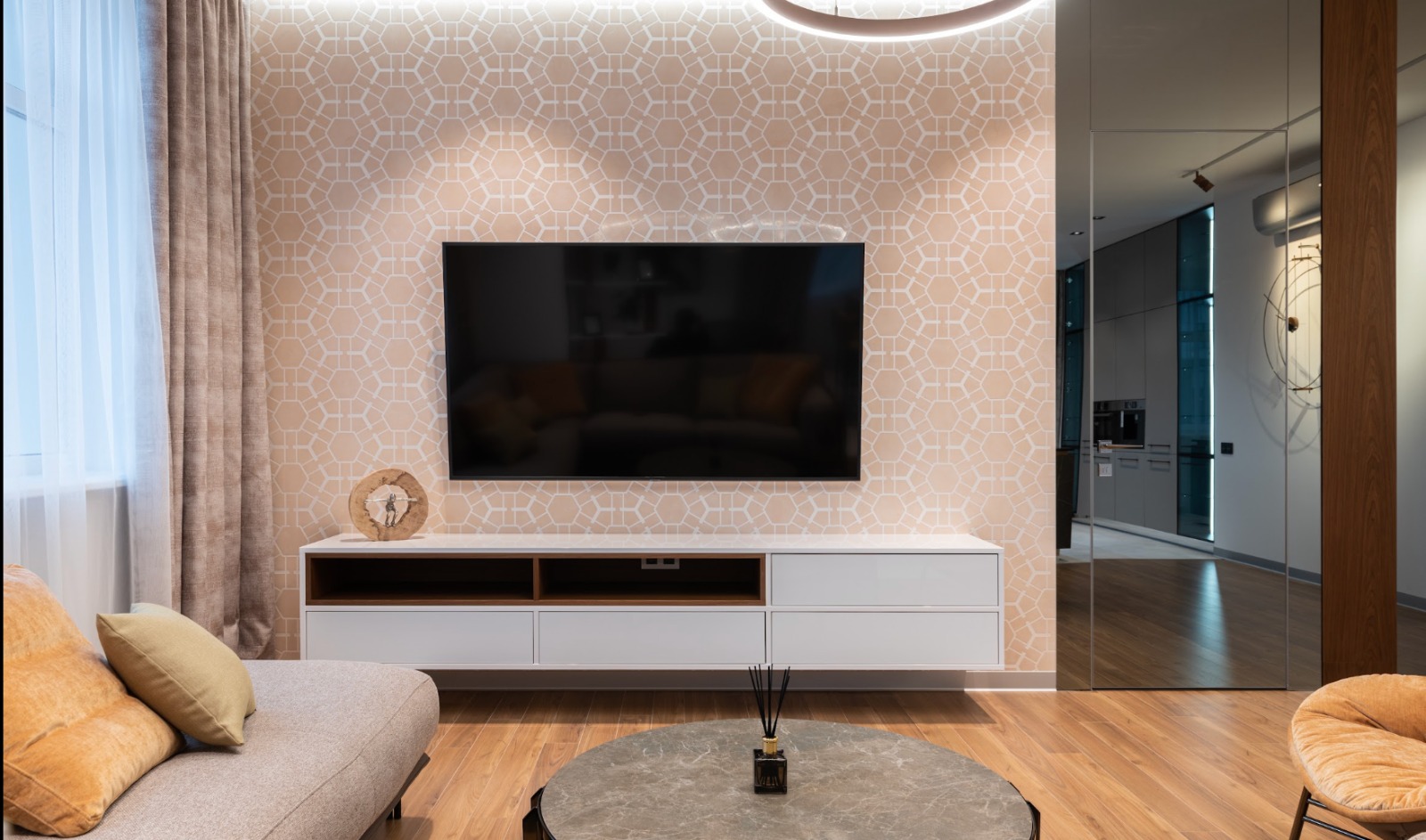 Living room TV unit with textured feature wall and handleless storage