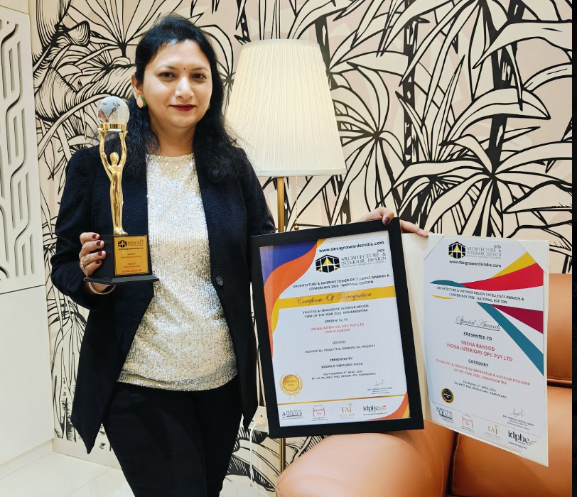 Sneha Bansod holding the Architecture & Interior Design Excellence Award 2026 trophy and certificates