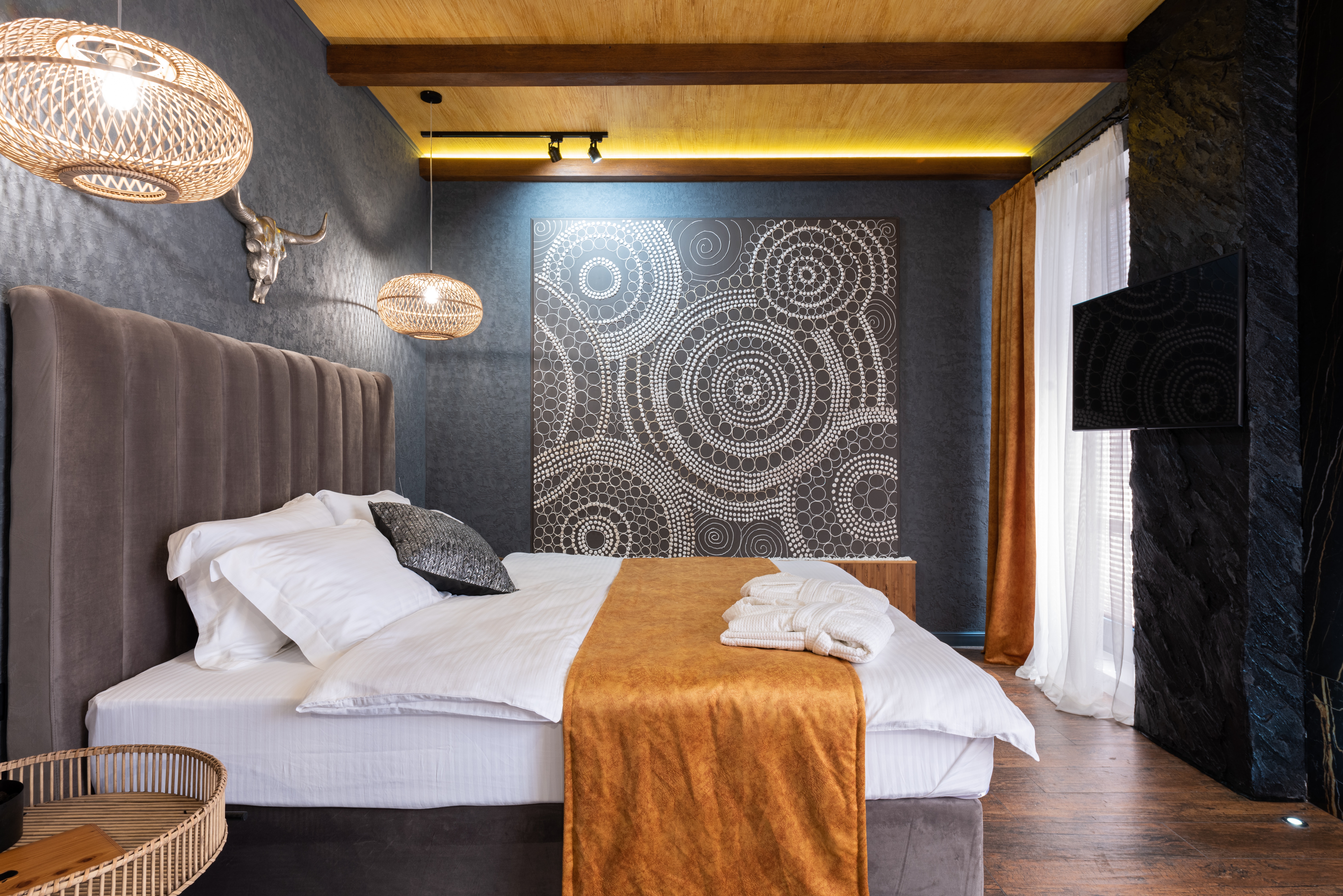 Hospitality suite interior with patterned feature wall and ambient lighting